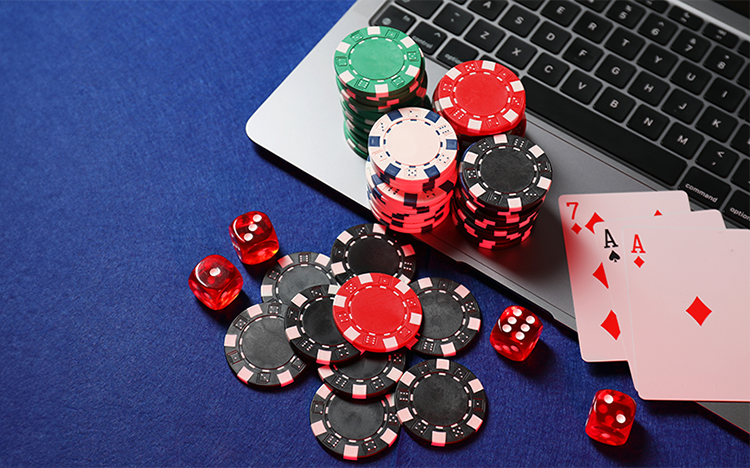 poker chips on computer keyboard - Illegal online gambling ring with sales of nearly EUR 1 billion ...