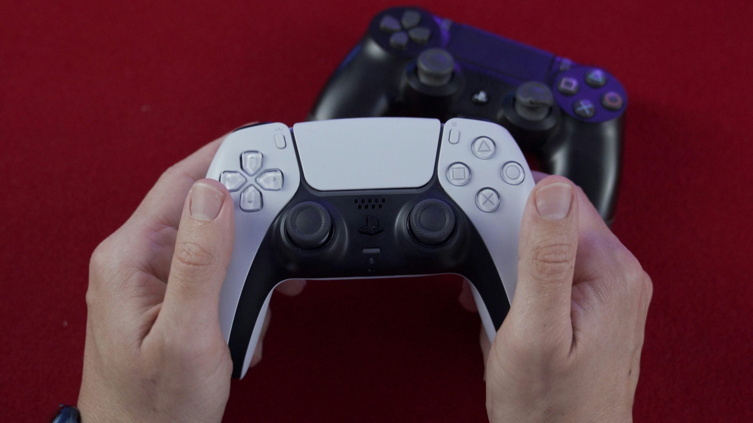 close up hands on gaming controller - PS5 DualSense controller hands on 