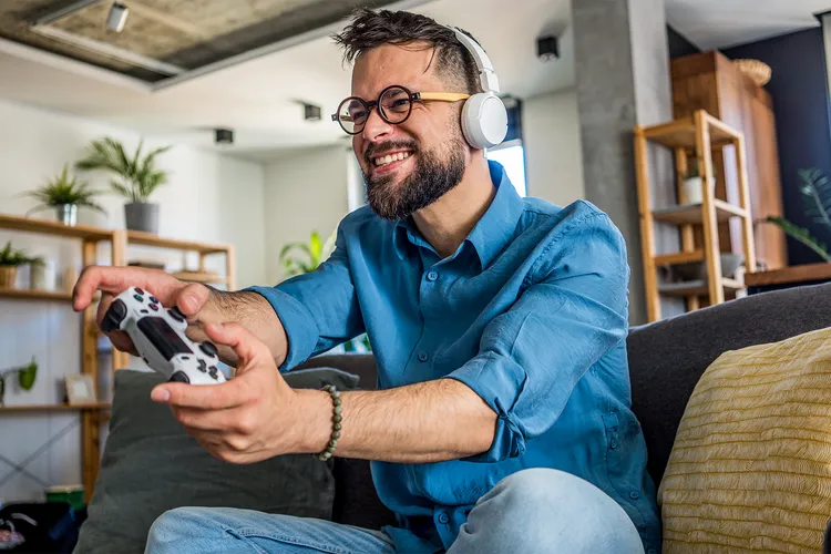 Gamer reading video game patch notes on screen - Video Game Addiction: Symptoms, Treatment, and Prevention